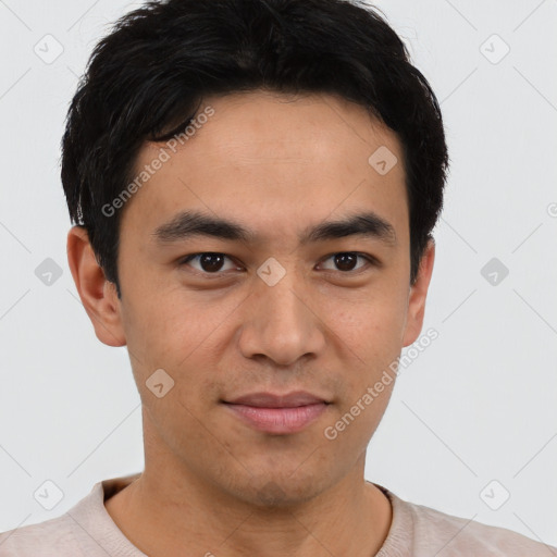 Joyful asian young-adult male with short  brown hair and brown eyes