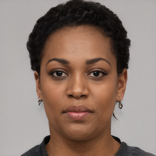 Neutral black young-adult female with short  black hair and brown eyes