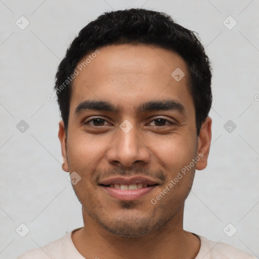 Joyful latino young-adult male with short  black hair and brown eyes