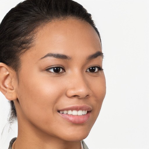 Joyful latino young-adult female with short  brown hair and brown eyes