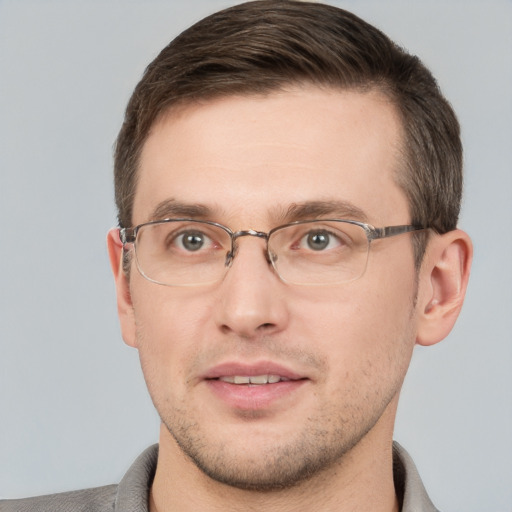 Joyful white adult male with short  brown hair and grey eyes