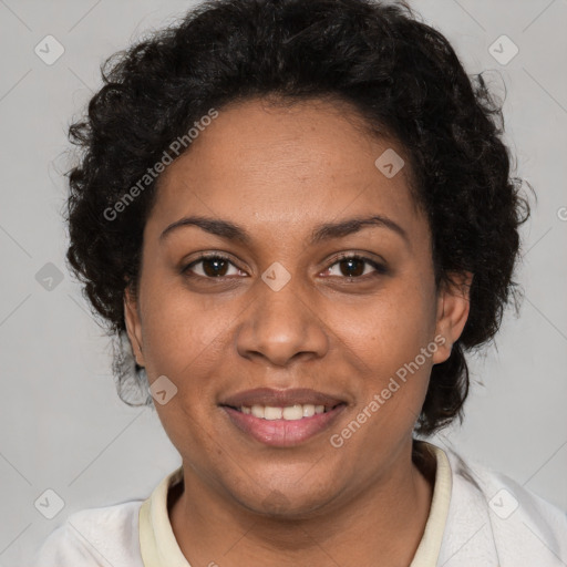 Joyful black adult female with short  brown hair and brown eyes