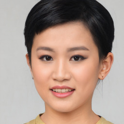 Joyful asian young-adult female with short  black hair and brown eyes