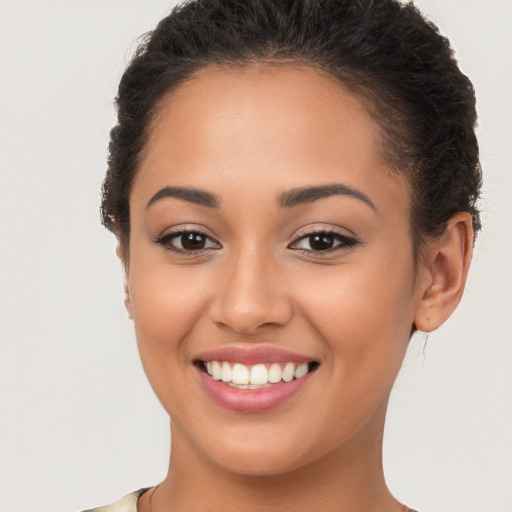 Joyful white young-adult female with short  brown hair and brown eyes