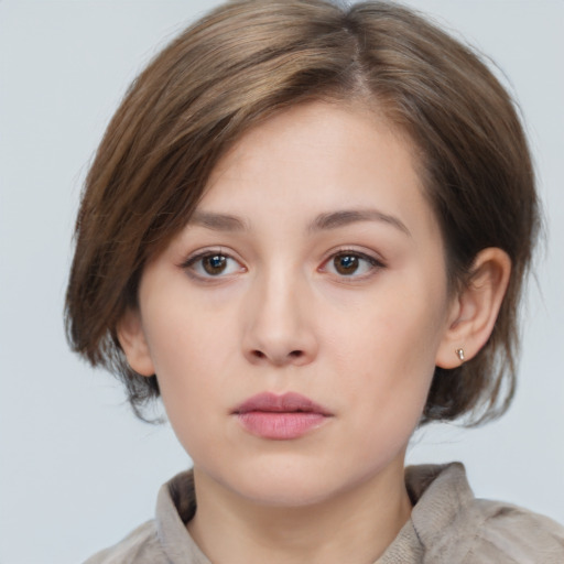 Neutral white young-adult female with medium  brown hair and grey eyes