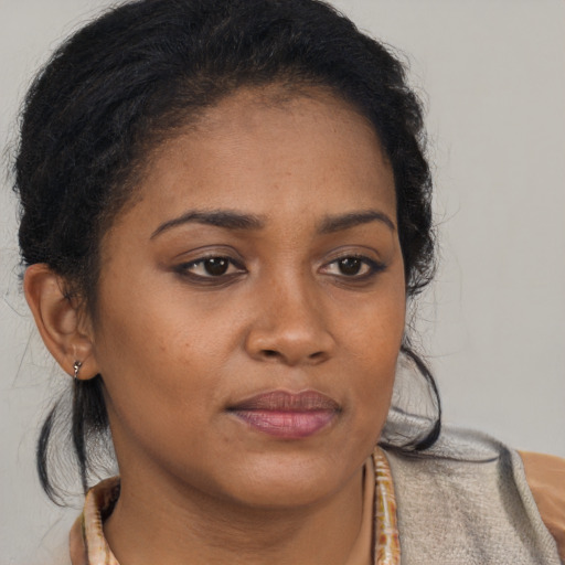 Neutral black young-adult female with medium  brown hair and brown eyes