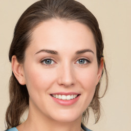 Joyful white young-adult female with medium  brown hair and green eyes