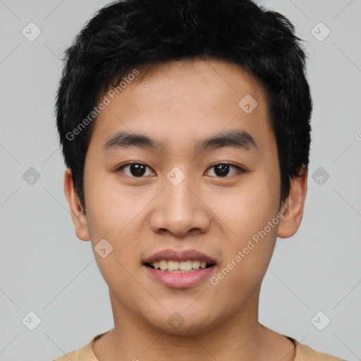 Joyful asian young-adult male with short  black hair and brown eyes