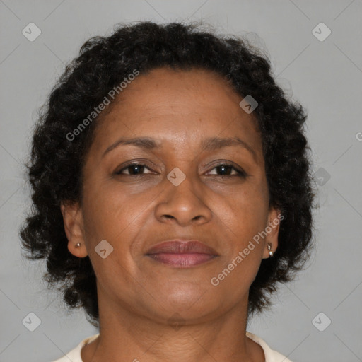 Joyful black adult female with medium  brown hair and brown eyes