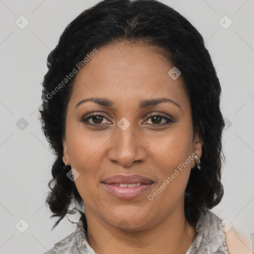 Joyful black adult female with medium  brown hair and brown eyes