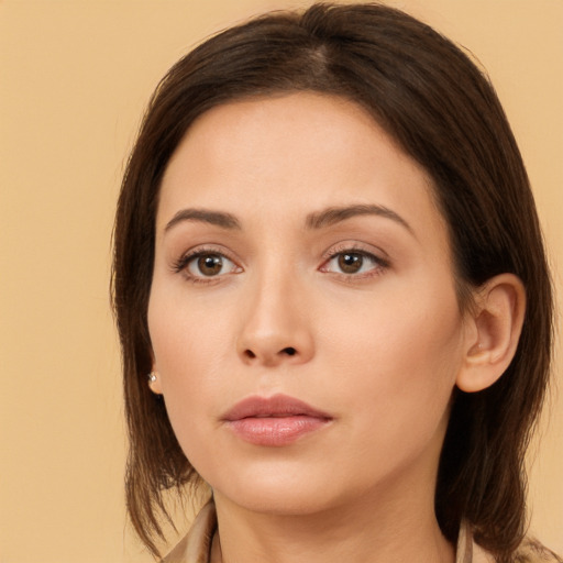 Neutral white young-adult female with medium  brown hair and brown eyes