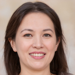 Joyful white young-adult female with medium  brown hair and brown eyes