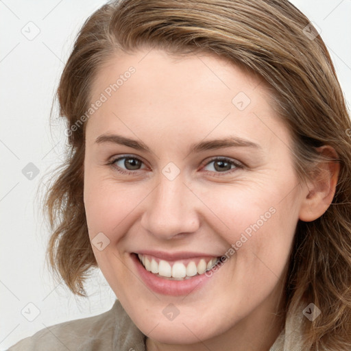 Joyful white young-adult female with medium  brown hair and blue eyes