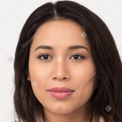 Joyful latino young-adult female with long  brown hair and brown eyes