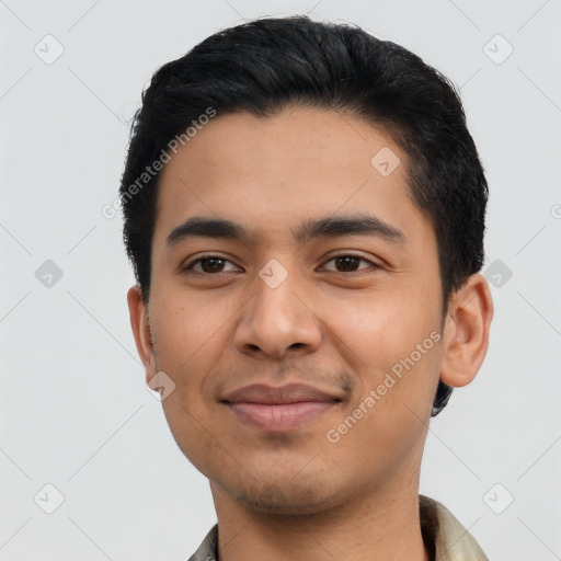 Joyful latino young-adult male with short  black hair and brown eyes