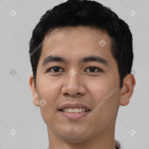 Joyful latino young-adult male with short  black hair and brown eyes