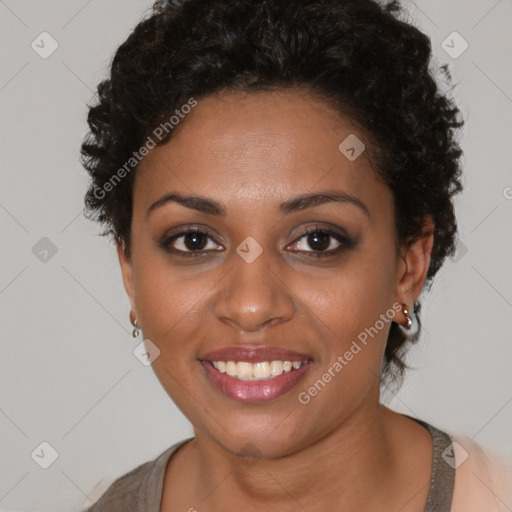 Joyful black young-adult female with short  brown hair and brown eyes