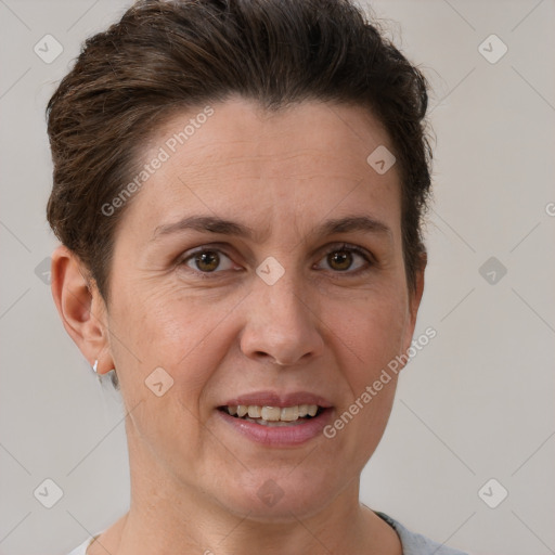 Joyful white adult female with short  brown hair and brown eyes