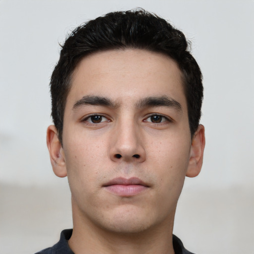 Neutral white young-adult male with short  black hair and brown eyes