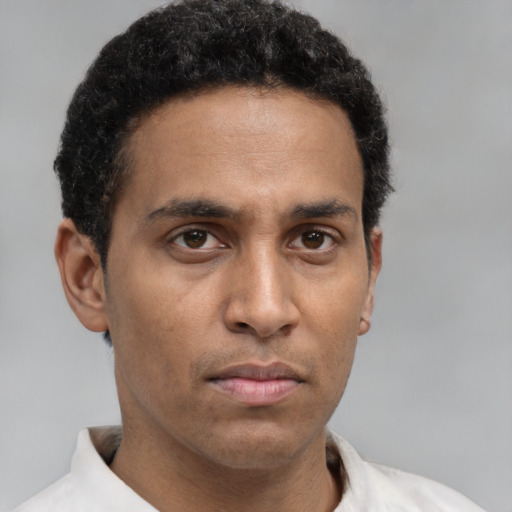 Neutral black young-adult male with short  brown hair and brown eyes