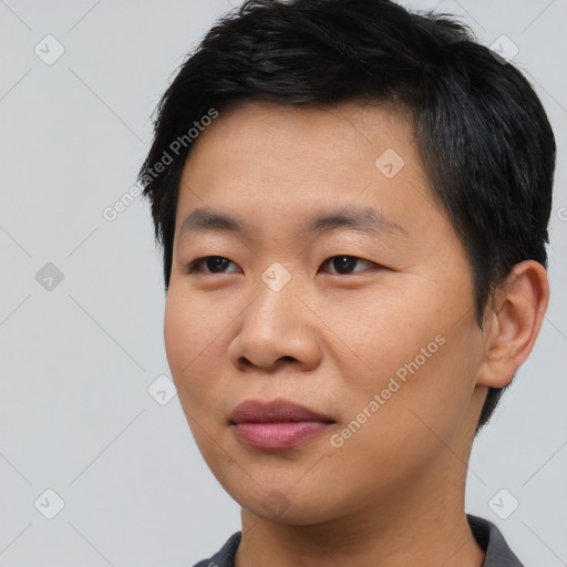 Joyful asian young-adult male with short  black hair and brown eyes