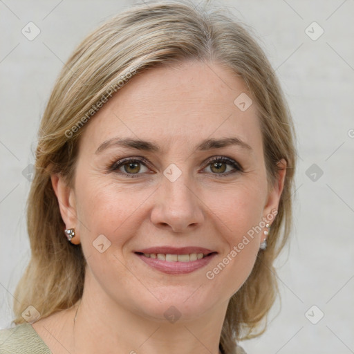 Joyful white adult female with medium  brown hair and grey eyes