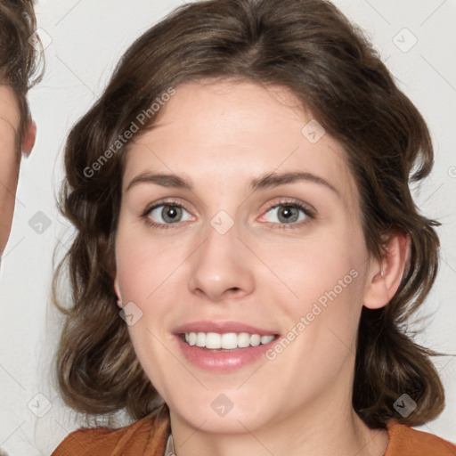 Joyful white young-adult female with medium  brown hair and green eyes