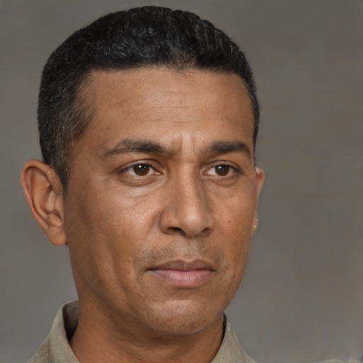 Neutral black adult male with short  brown hair and brown eyes