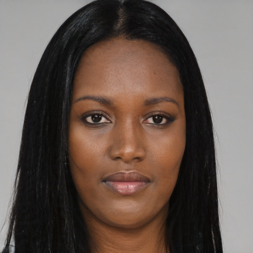 Joyful asian young-adult female with long  black hair and brown eyes
