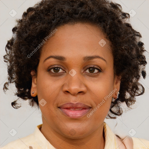 Joyful black adult female with medium  brown hair and brown eyes