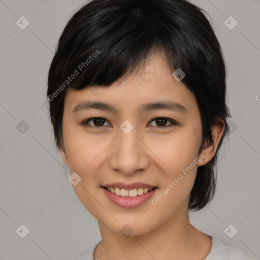 Joyful asian young-adult female with medium  black hair and brown eyes