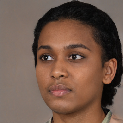 Neutral black young-adult female with short  black hair and brown eyes