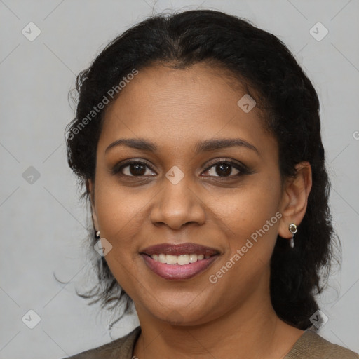 Joyful black young-adult female with medium  brown hair and brown eyes