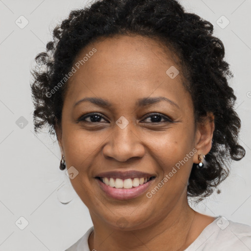 Joyful black adult female with short  brown hair and brown eyes