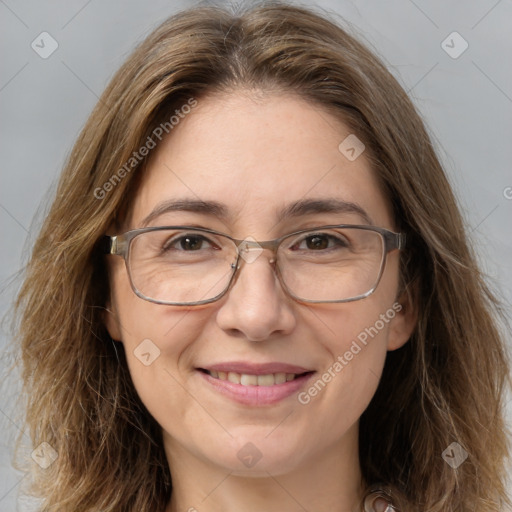 Joyful white adult female with medium  brown hair and brown eyes