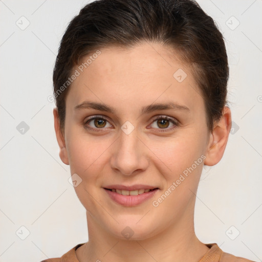 Joyful white young-adult female with short  brown hair and brown eyes