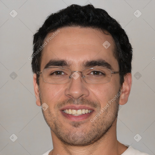 Joyful white adult male with short  black hair and brown eyes