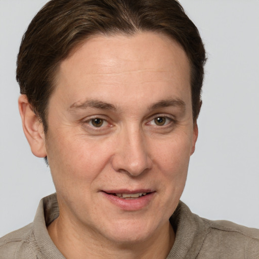 Joyful white adult female with short  brown hair and grey eyes