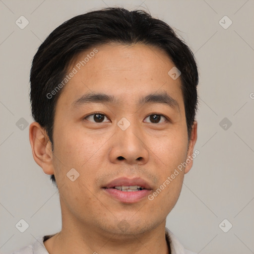 Joyful asian young-adult male with short  brown hair and brown eyes