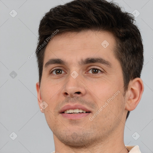 Joyful white young-adult male with short  brown hair and brown eyes