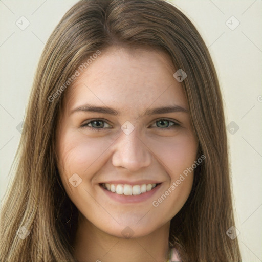 Joyful white young-adult female with long  brown hair and green eyes