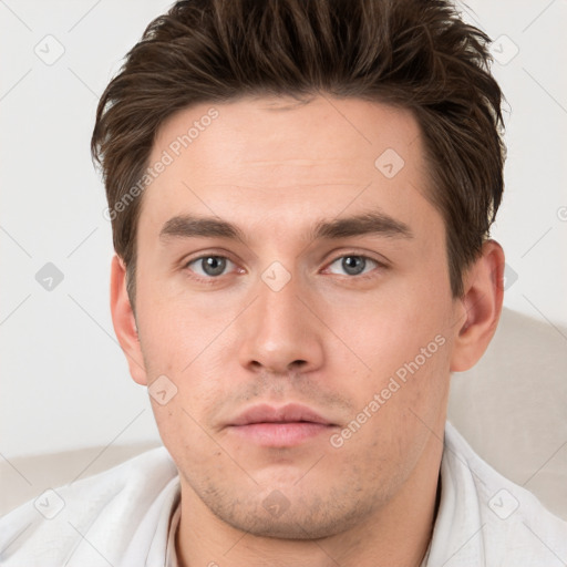 Neutral white young-adult male with short  brown hair and brown eyes