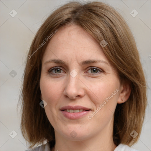 Joyful white adult female with medium  brown hair and grey eyes