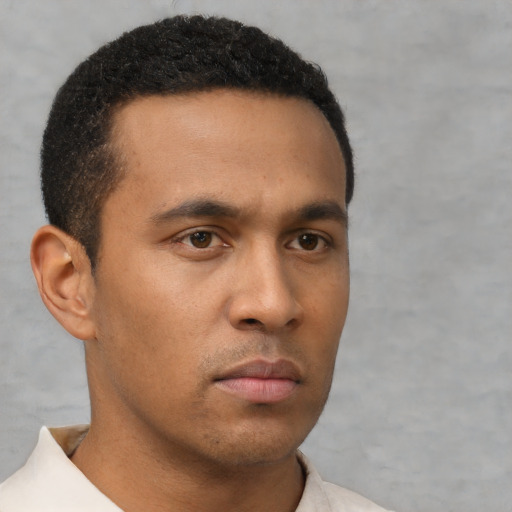 Neutral latino young-adult male with short  brown hair and brown eyes