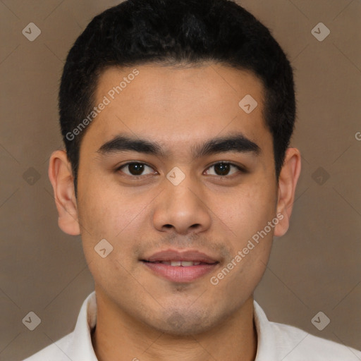 Joyful latino young-adult male with short  black hair and brown eyes