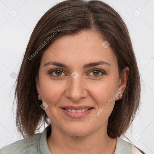 Joyful white young-adult female with medium  brown hair and green eyes