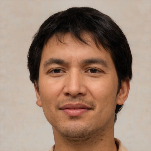 Joyful white adult male with short  brown hair and brown eyes