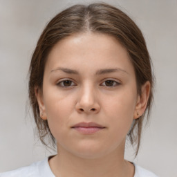 Neutral white young-adult female with medium  brown hair and brown eyes