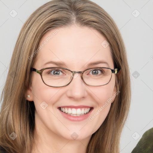 Joyful white adult female with medium  brown hair and green eyes