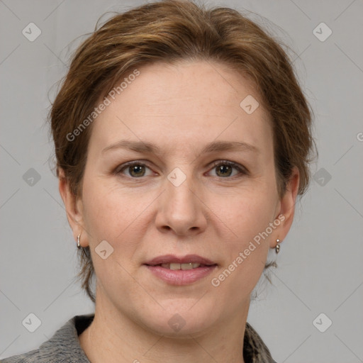 Joyful white adult female with medium  brown hair and grey eyes